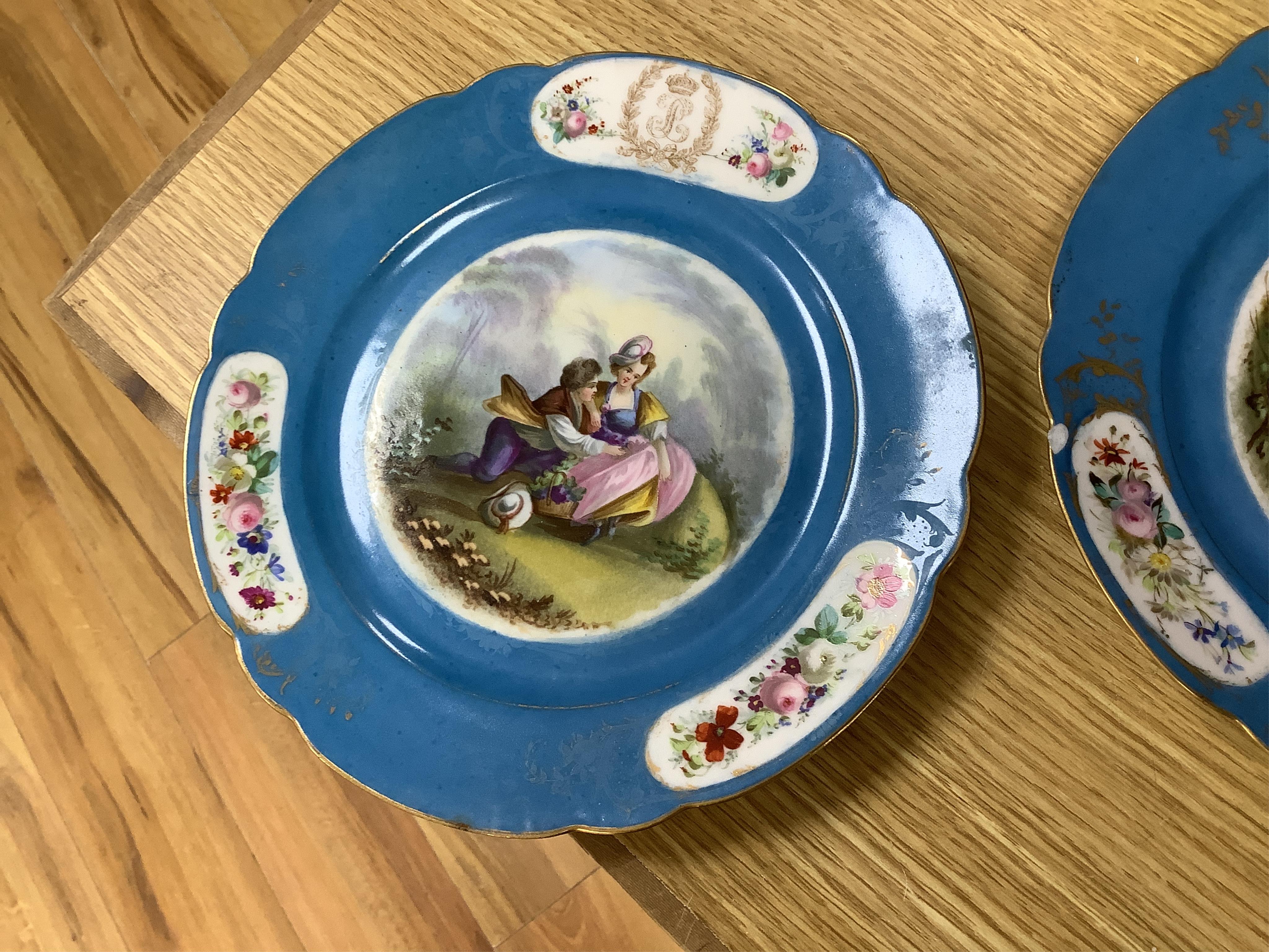 A set of eight 19th century Sevres style bleu celeste ground cabinet plates, each painted with a courting couple, 22cm diameter